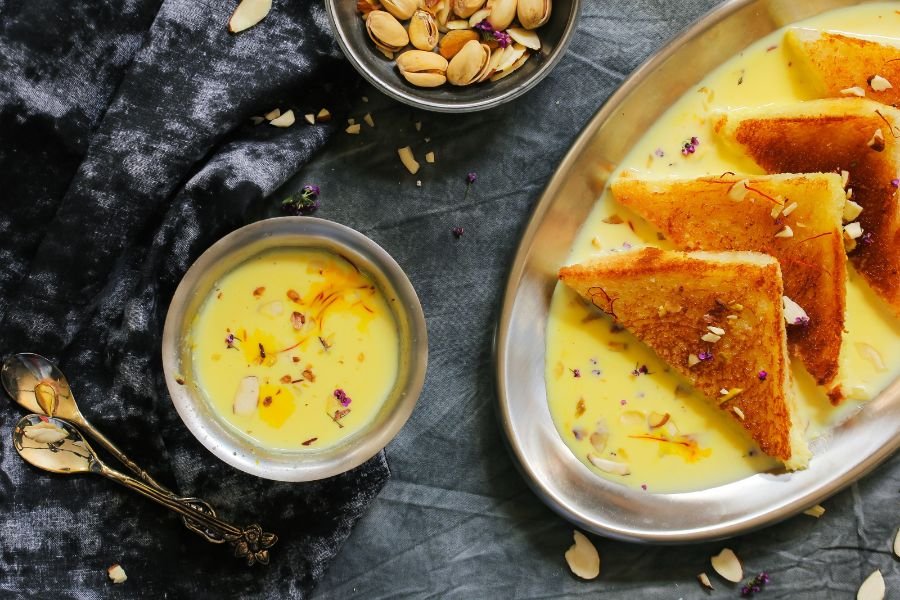 "This image shows a delicious serving of Shahi Tukda, a traditional Indian dessert made with bread, milk, and sugar."